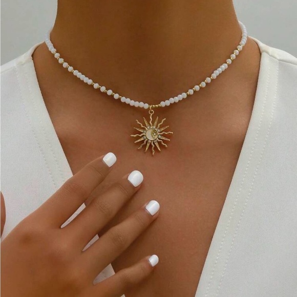 Anthropologie Gold and beaded White Necklace with Sunburst Pendant summer 2025 - Picture 1 of 4